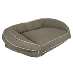 Brown pet bed with white trim on a white background