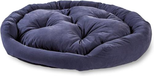 A round, tufted pet bed in a deep navy blue velvet fabric, shown on a plain white background.