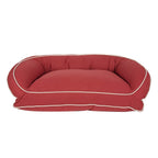 Red pet bed with white trim on a white background