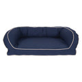 Navy blue pet bed with white trim on a white background