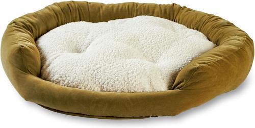 Dog bed with brown exterior and white interior on a white background