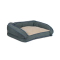 Pet bed with green woven exterior and beige cushion on a white background