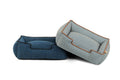 Two pet beds, one blue and one gray with brown trim, on a white background.