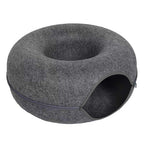 Gray donut-shaped pet bed on a white background