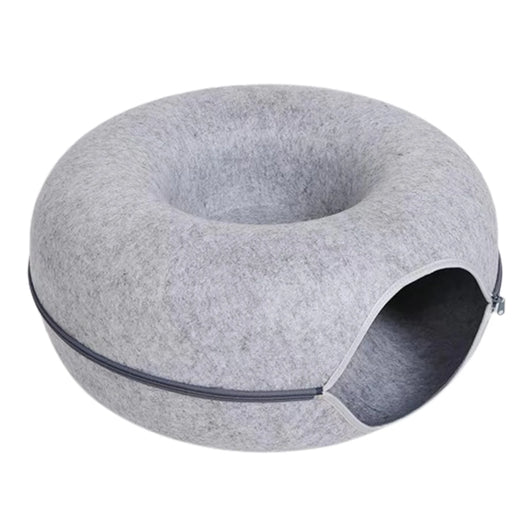 Gray donut-shaped pet bed on a white background