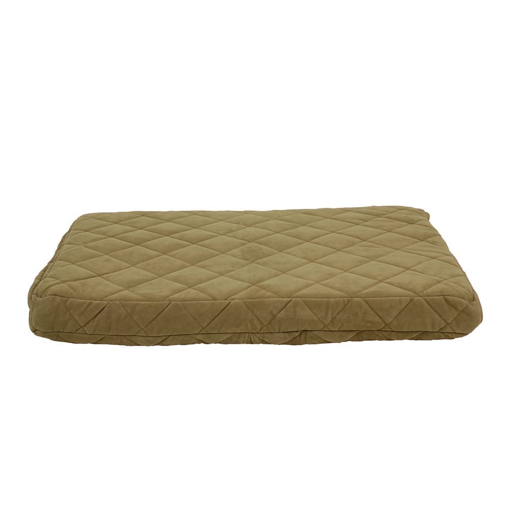 Quilted green pet bed on a beige background